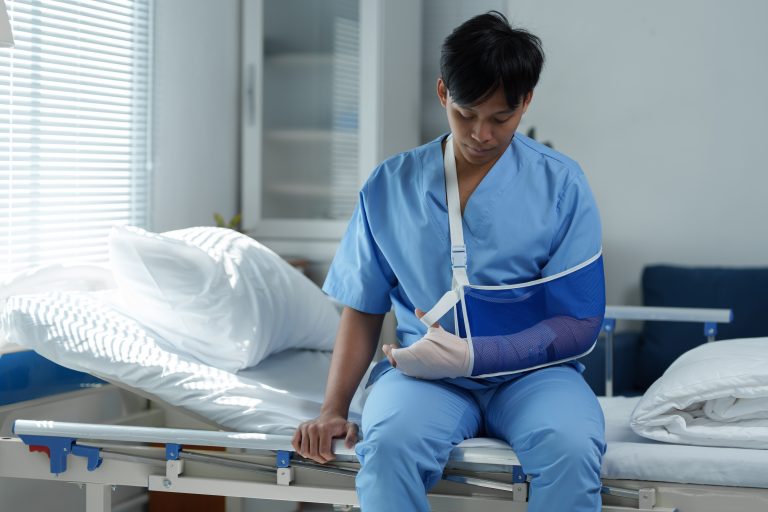 atient recovering with arm sling during ⁠Post Surgery Rehabilitation Sherwood Park, Pre Surgery Rehabilitation Sherwood Park physiotherapy treatment.