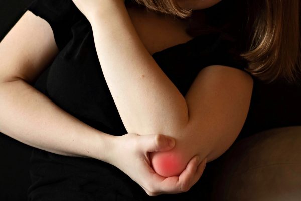 adult-woman-holding-her-elbow-in-pain-2026-03-20-05-54-58-utc